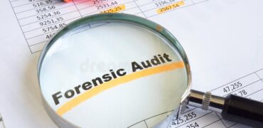 forensic-audit-data-magnifying-glass-papers-documents-214636733